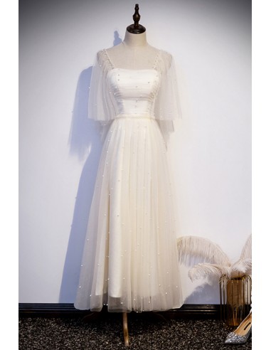Elegant Champagne Gown with Shimmering Beadwork And Tea-length Hem